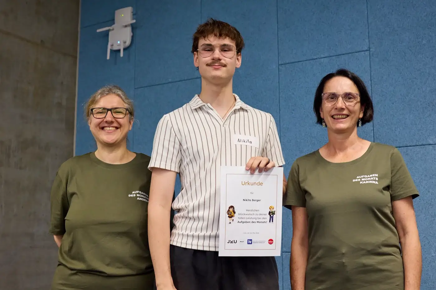 Nikita Berger holding a JKU Aufgaben des Monats mathematics certificate in May 2026